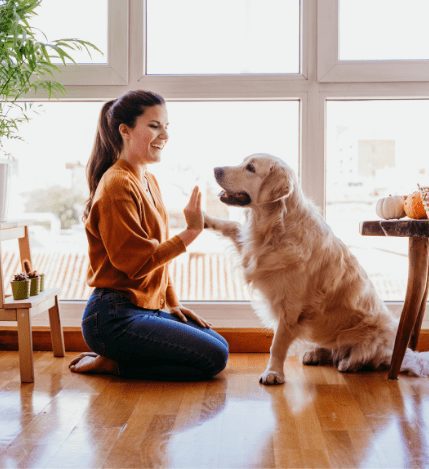 woman and dog | Tips for First-Time Home Buyers